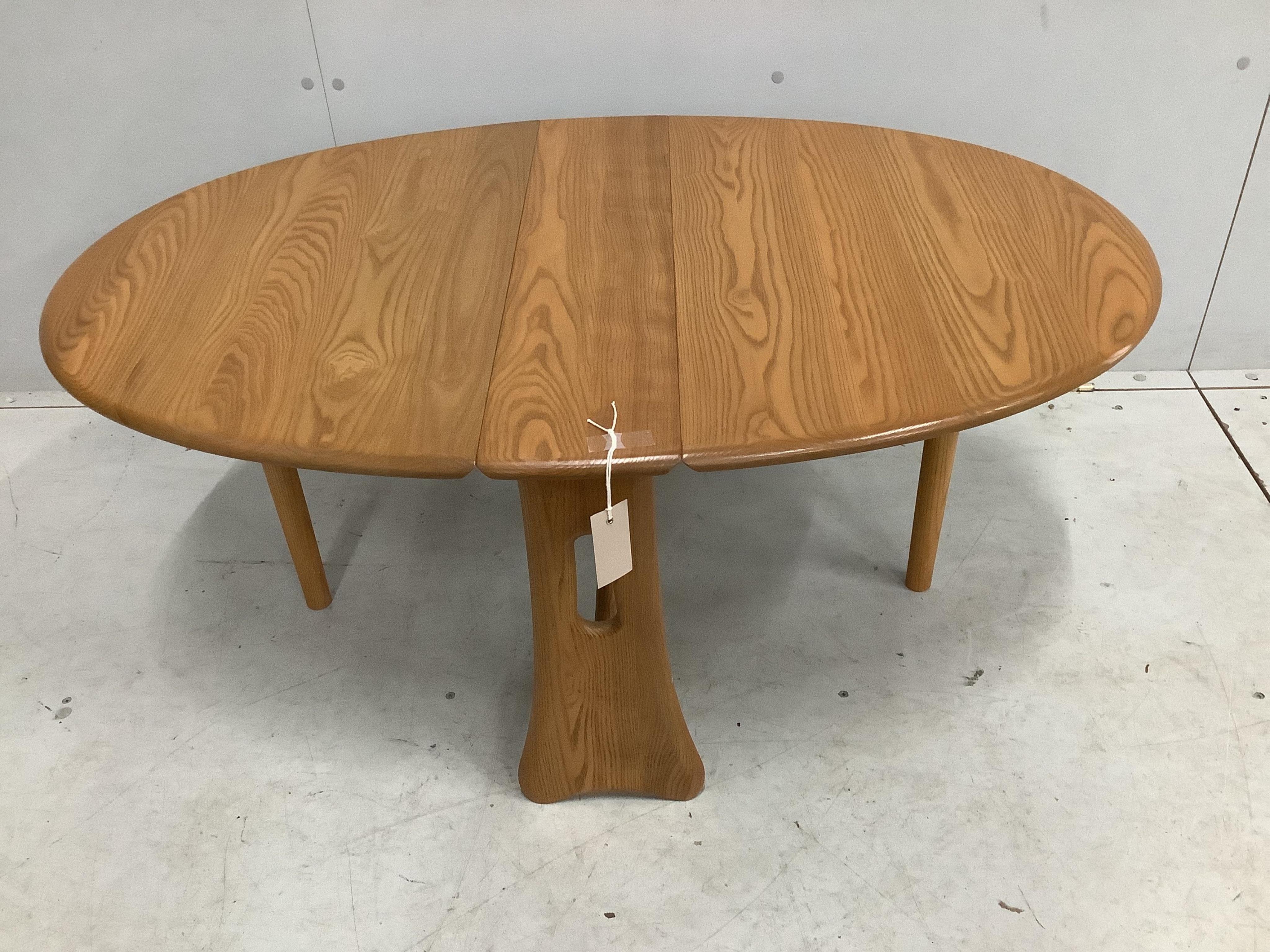 An Ercol elm Sutherland table, width 69cm, depth 17cm, height 46cm. Condition - good